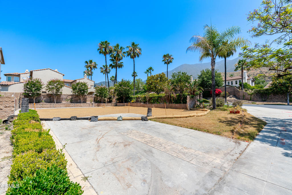 3769 North Hollingsworth Road Altadena, CA 91001 - Photo 2 of 13 a view of a swimming pool with a lawn chairs and a potted plants