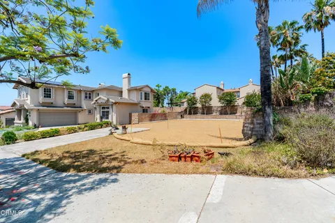 an aerial view of a house with a swimming pool