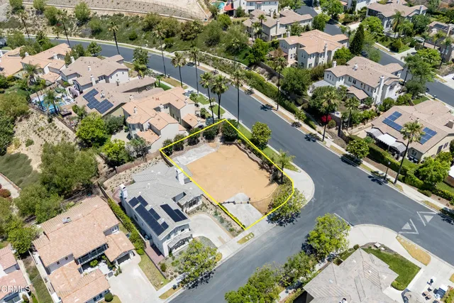 an aerial view of a house with a garden