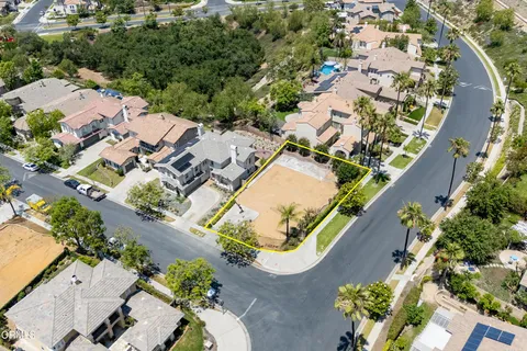 an aerial view of a house with a swimming pool