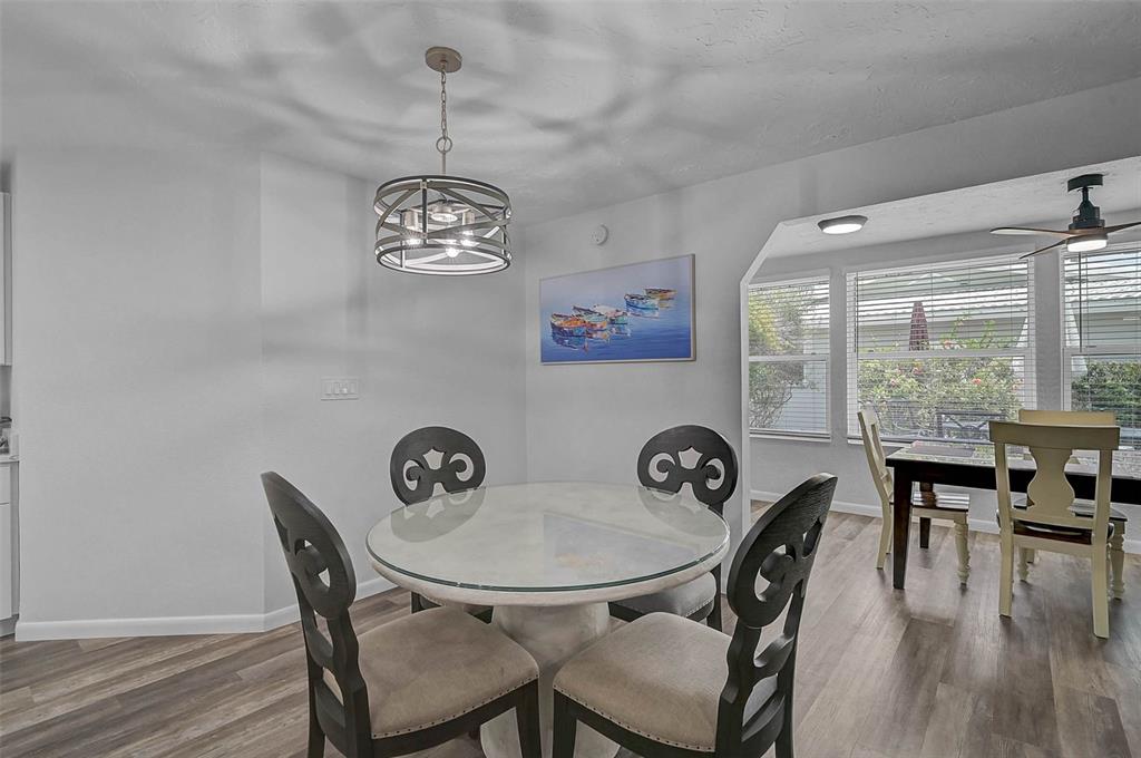 6308 Midnight Pass Road, Unit 6 Sarasota, FL 34242 - Photo 12 of 44 a view of a dining room with furniture window and outside view