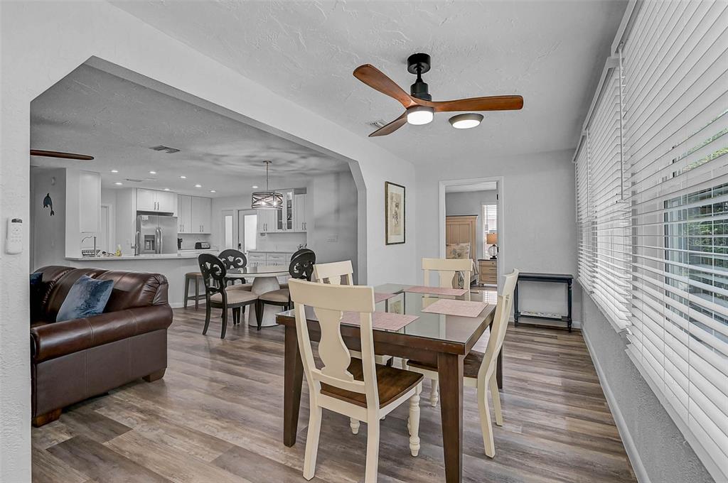 6308 Midnight Pass Road, Unit 6 Sarasota, FL 34242 - Photo 18 of 44 a living room with furniture and a wooden floor