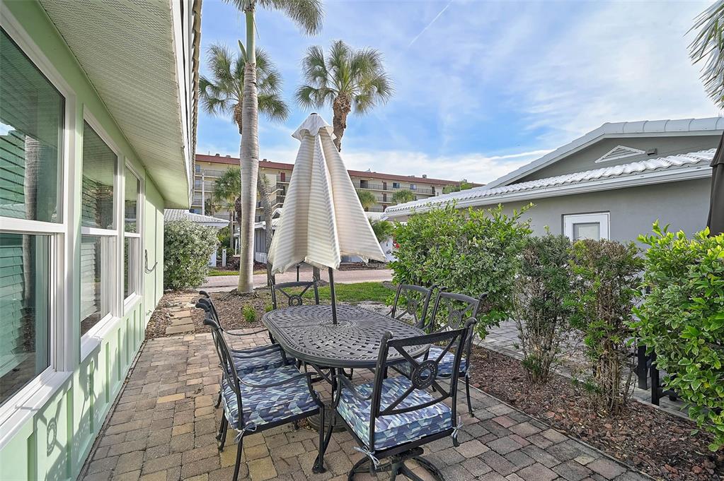 6308 Midnight Pass Road, Unit 6 Sarasota, FL 34242 - Photo 26 of 44 a view of outdoor space yard and patio