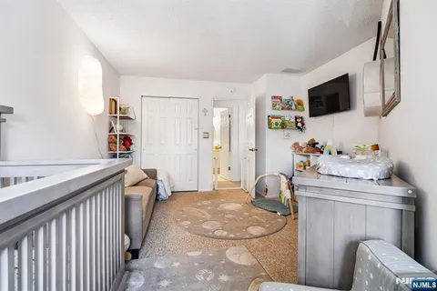 a bedroom with furniture and a bed