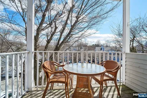 a table and chairs in a balcony