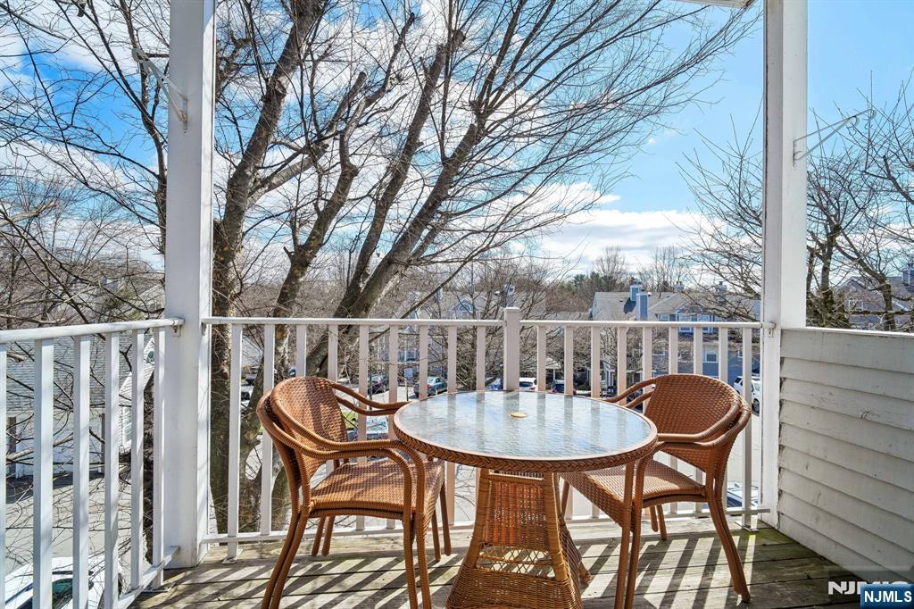 1317 Paddington Road Mahwah, NJ 07430 - Photo 21 of 28 a table and chairs in a balcony