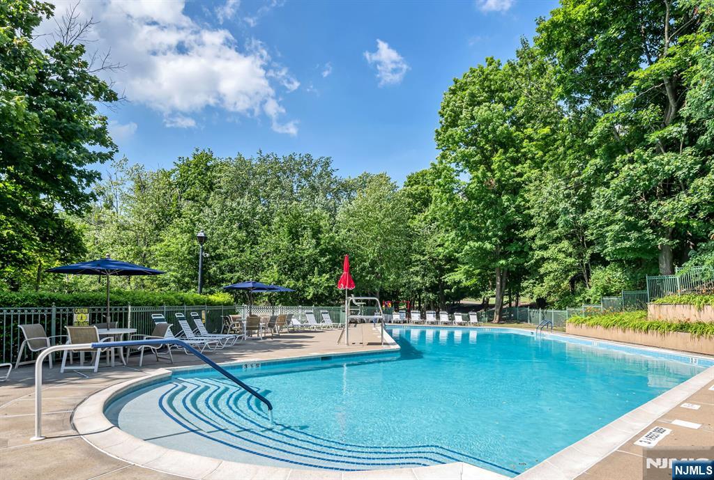 1317 Paddington Road Mahwah, NJ 07430 - Photo 25 of 28 a view of a swimming pool with chairs