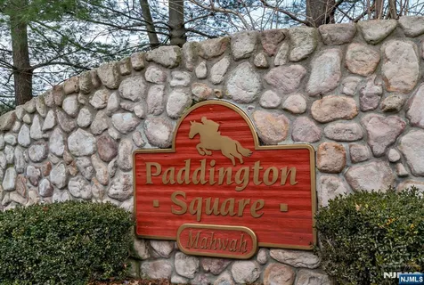 a view of sign board with a tree