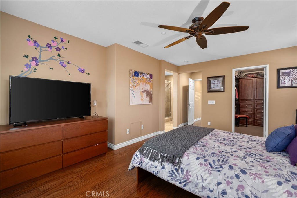 4140 Garvey Way Riverside, CA 92501 - Photo 12 of 25 a bedroom with a bed and a flat screen tv