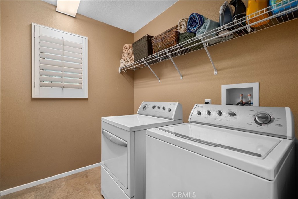 4140 Garvey Way Riverside, CA 92501 - Photo 18 of 25 a utility room with dryer and washer