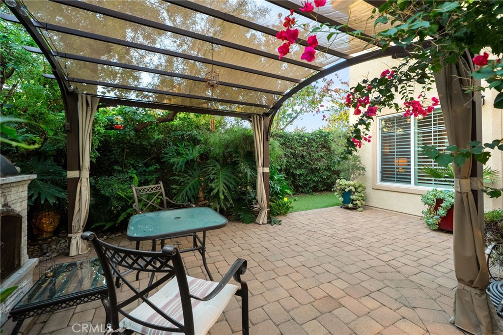 4140 Garvey Way Riverside, CA 92501 - Photo 19 of 25 a patio with a table and chairs and potted plants