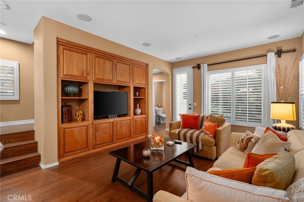 4140 Garvey Way Riverside, CA 92501 - Photo 3 of 25 a living room with furniture a flat screen tv and a large window