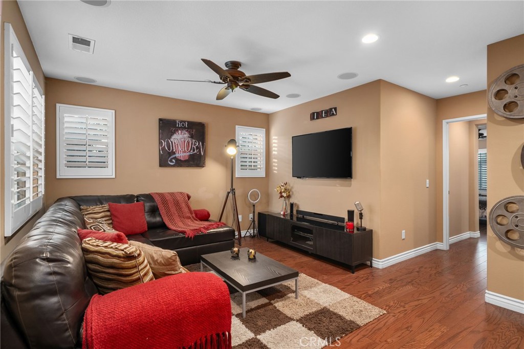 4140 Garvey Way Riverside, CA 92501 - Photo 10 of 25 a living room with furniture and a flat screen tv