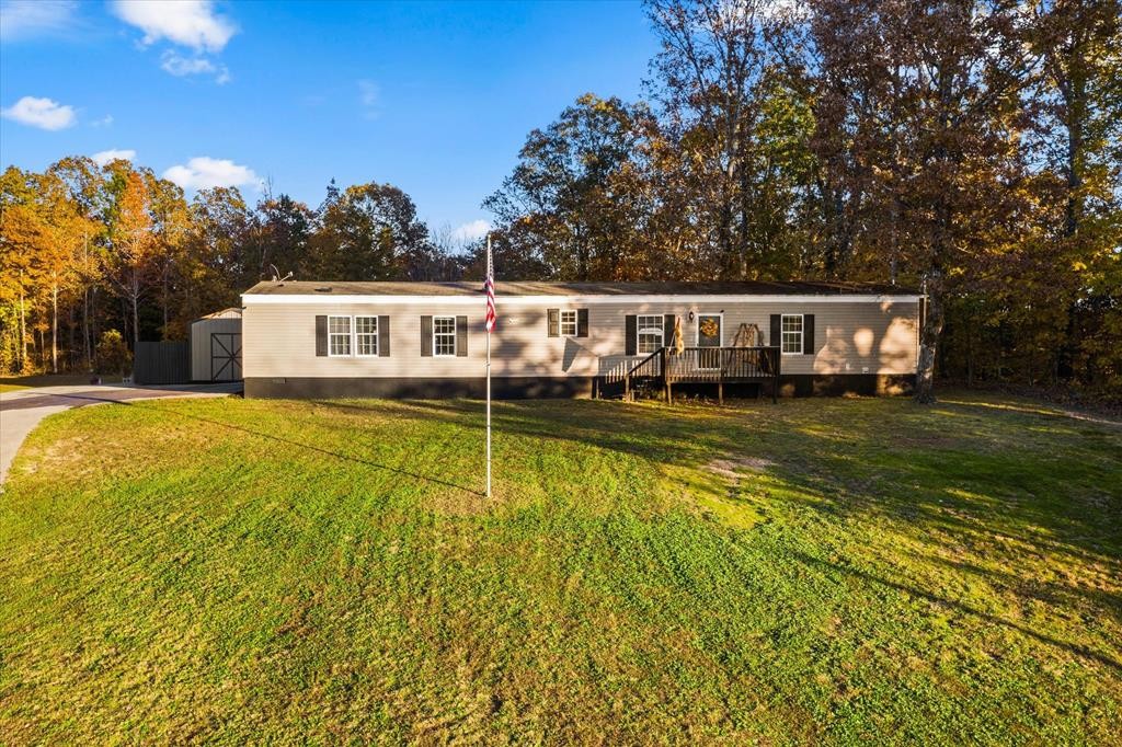 a view of a house with a big yard