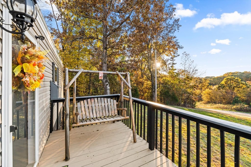 160 Beverly Drive Decatur, TN 37322 - Photo 4 of 31 a view of a balcony with wooden floor and fence