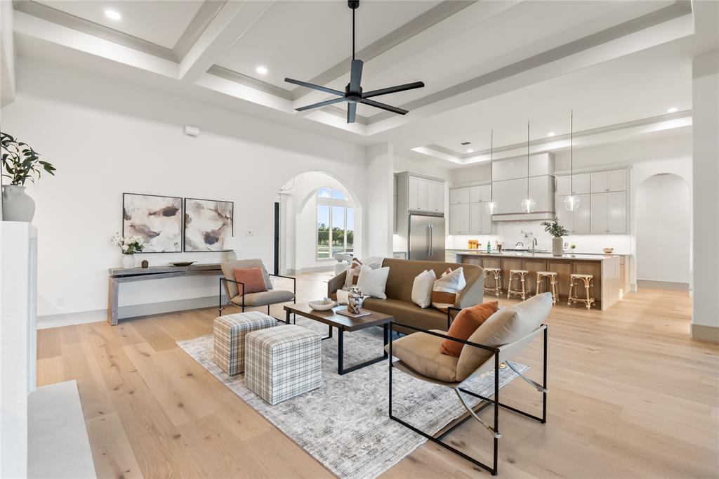 724 Cooper Trail Weatherford, TX 76087 - Photo 17 of 37 Expansive interior featuring light wood-finish flooring, a coffered ceiling with recessed lighting, and a modern ceiling fan