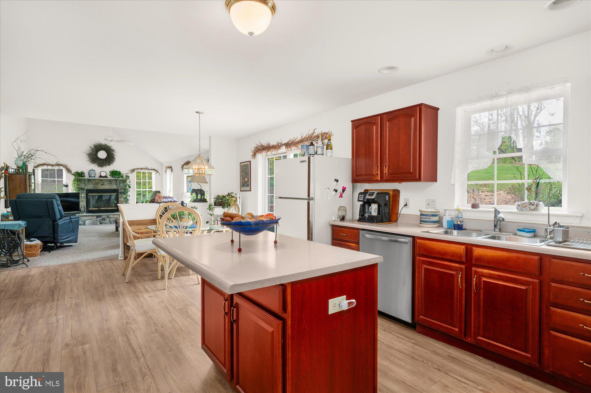 861 Dunkels Church Road Kutztown, PA 19530 - Photo 14 of 55 a open kitchen with stainless steel appliances granite countertop a stove top oven a sink dishwasher and cabinets with wooden floor