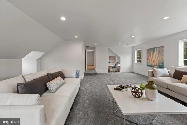 a living room with furniture and a table