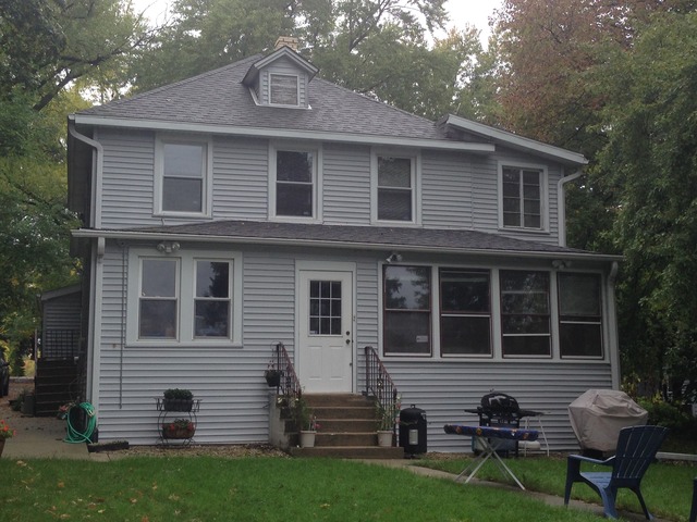 34175 North Hainesville Road, Unit 1F Round Lake, IL 60073 - Photo 1 of 1 a front view of a house with garden