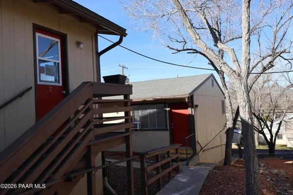 a bathroom with a sink toilet and mirror