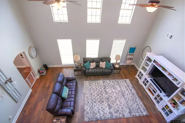 a living room with furniture and a fireplace