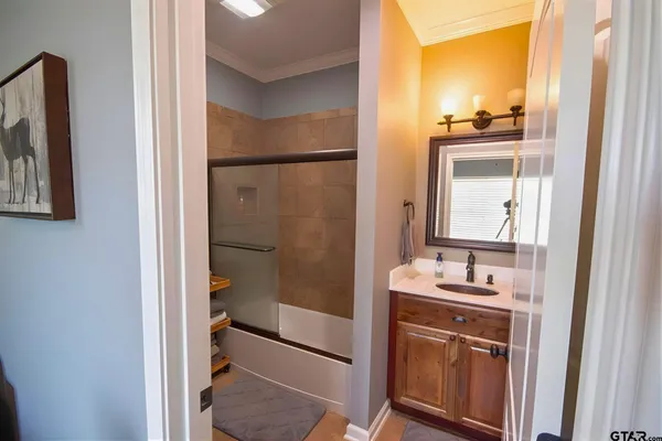 a bathroom with a sink and a mirror