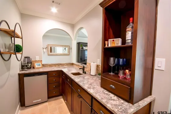 a kitchen with stainless steel appliances granite countertop a sink and cabinets
