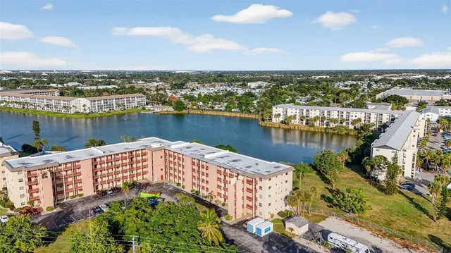 an aerial view of a house with a lake view
