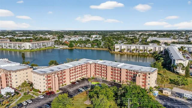 an aerial view of a house with a lake view