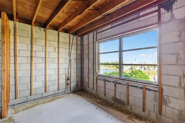 a view of a black door and a window
