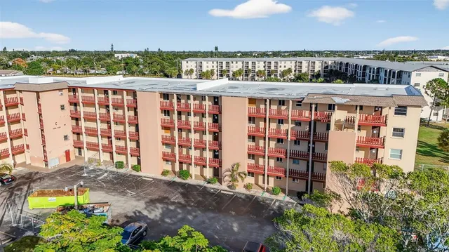 a view of a balcony with an outdoor seating