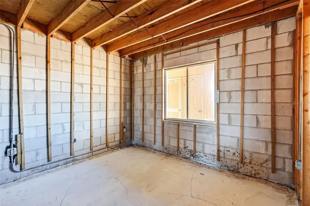 a view of building with parking space and large windows