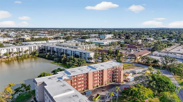 an aerial view of a city with lake view