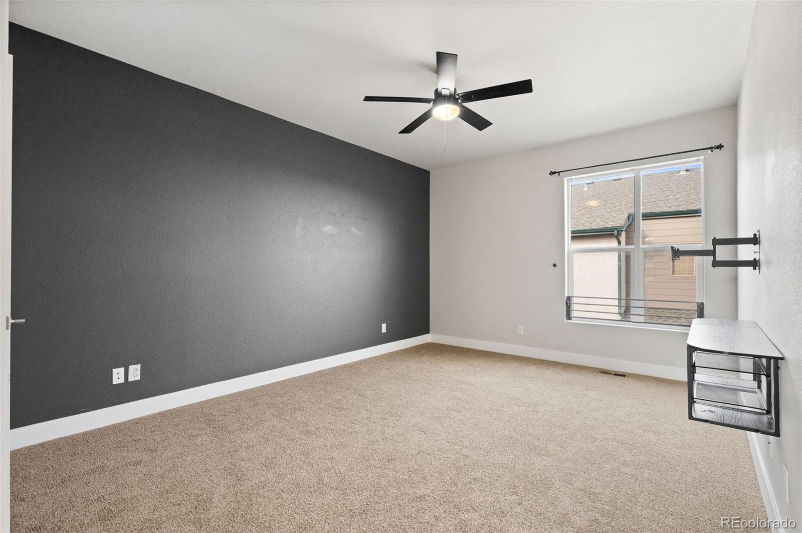 2360 South Wheeling Circle Aurora, CO 80014 - Photo 18 of 31 an empty room with windows and fan