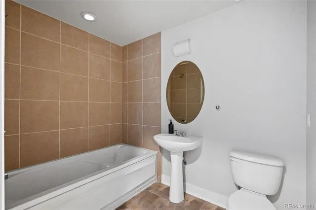 a room with a sink cabinets and utility