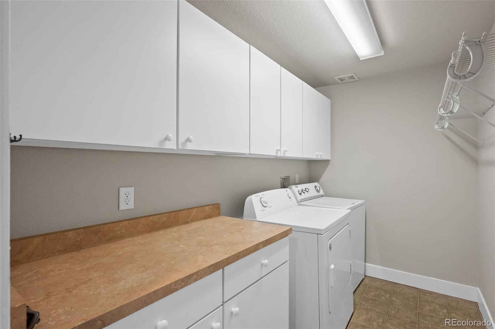 2360 South Wheeling Circle Aurora, CO 80014 - Photo 24 of 31 a room with a sink cabinets and utility