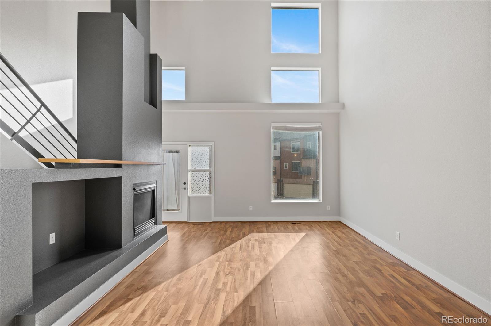 2360 South Wheeling Circle Aurora, CO 80014 - Photo 7 of 31 a view of an empty room with wooden floor and a window