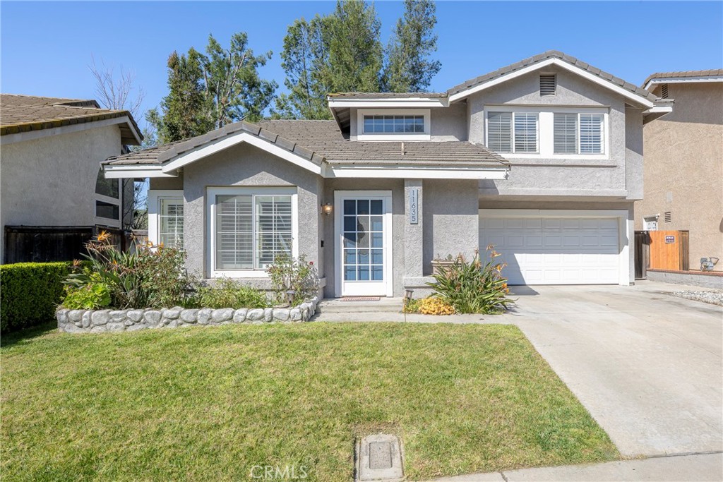 11635 Chadwick Road Corona, CA 92878 - Photo 1 of 1 a front view of a house with a yard