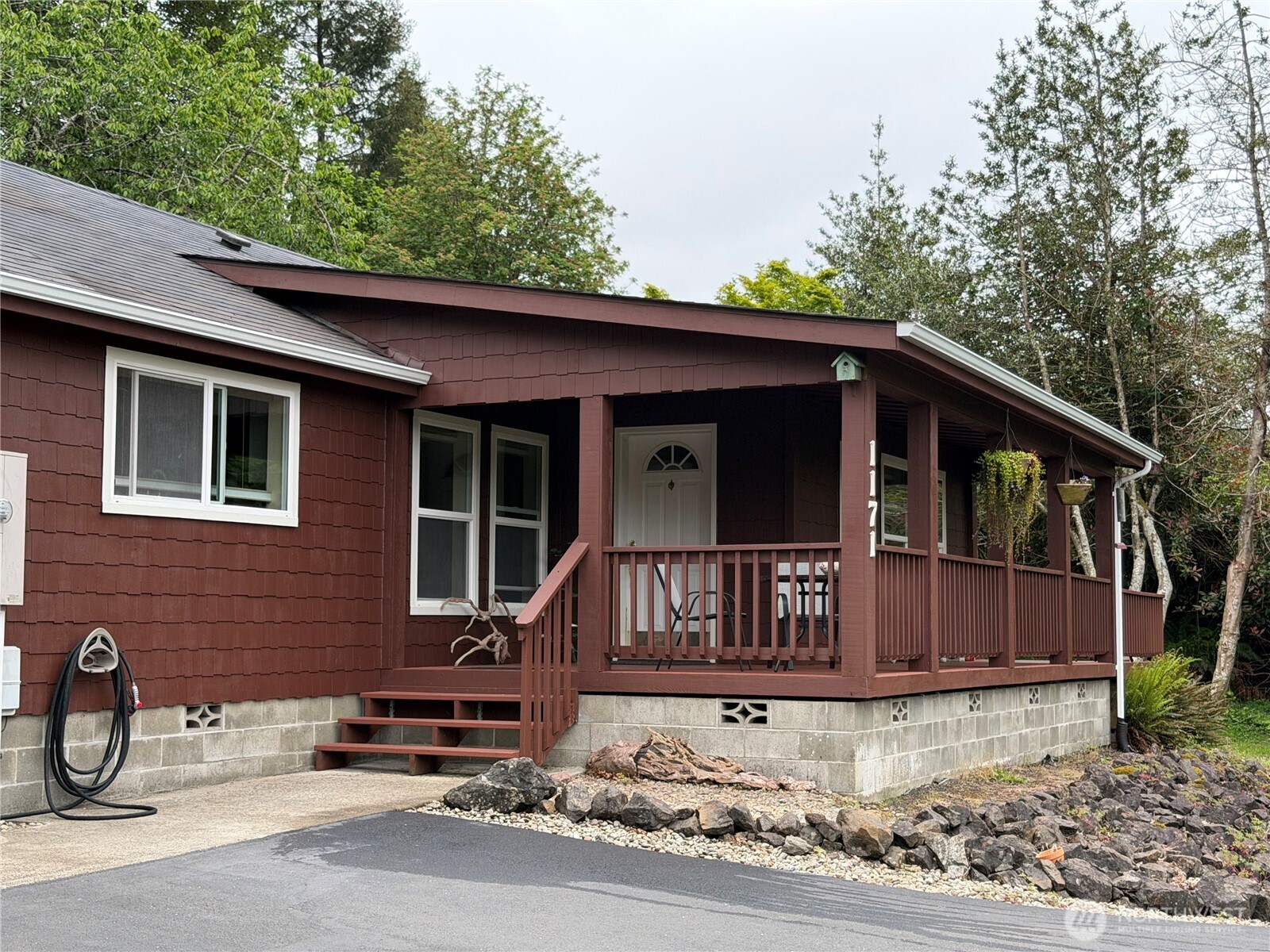 1171 Ray Hicks Street Raymond, WA 98577 - Photo 1 of 33 a view of a house with a yard and wooden fence