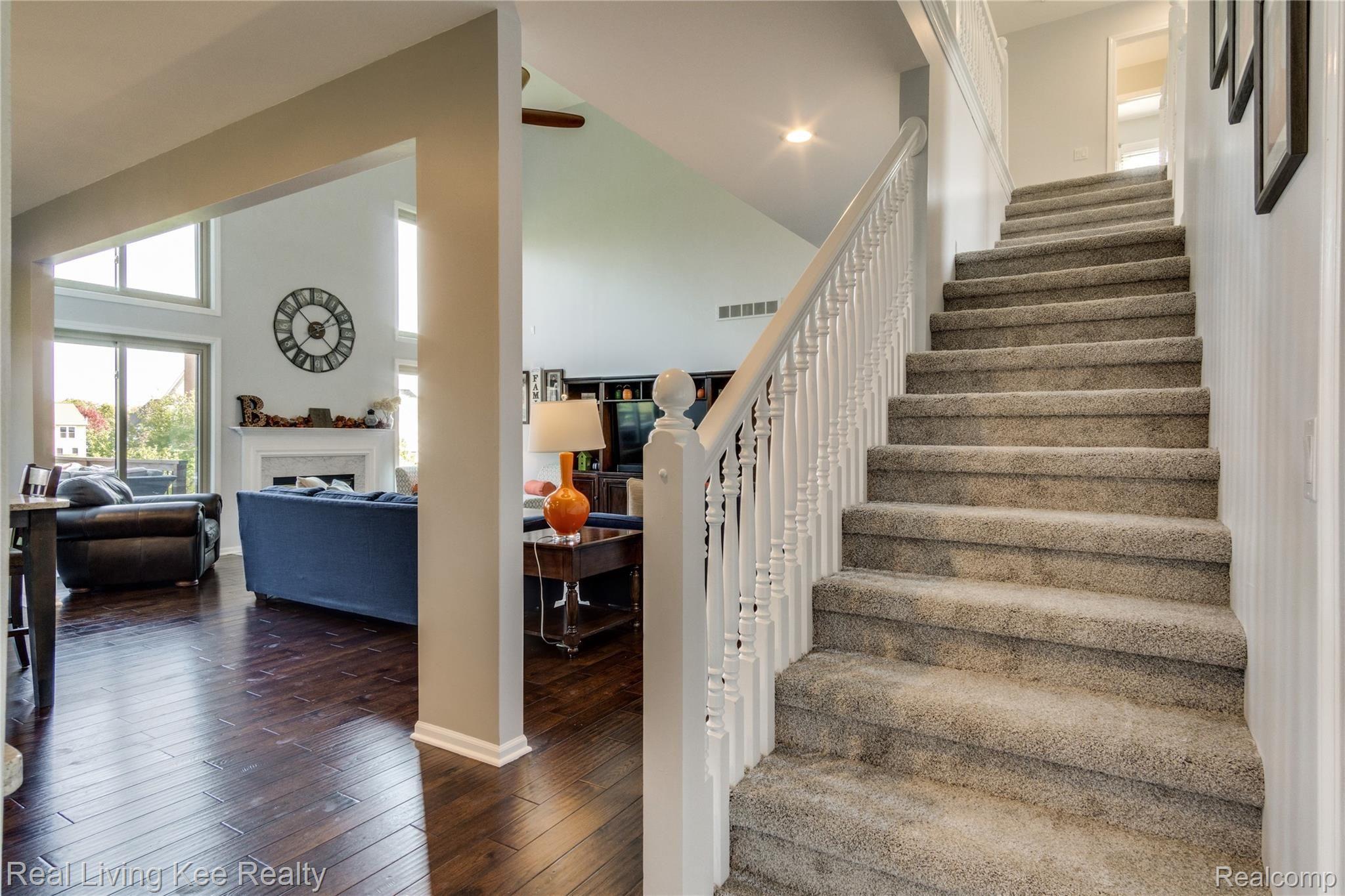 3975 May Center Road Lake Orion, MI 48360 - Photo 32 of 48 Dual-staircase with new carpet throughout the 2nd level.