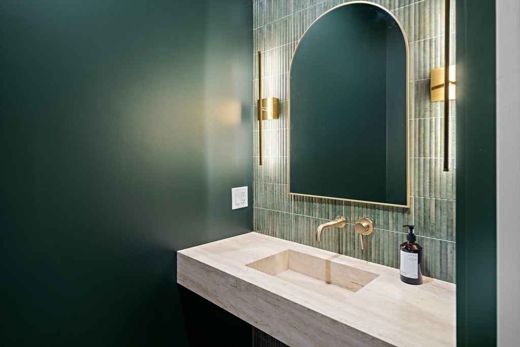 27 2nd Street Natick, MA 01760 - Photo 13 of 39 a bathroom with a sink and a mirror
