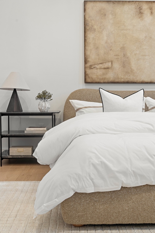 27 2nd Street Natick, MA 01760 - Photo 19 of 39 a bedroom with a bed and couch