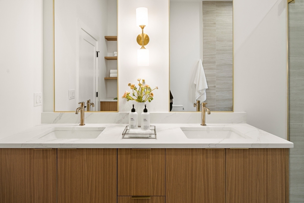 27 2nd Street Natick, MA 01760 - Photo 22 of 39 a bathroom with a double vanity sink and a mirror