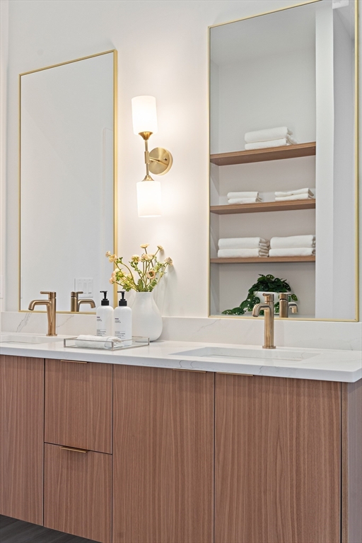 27 2nd Street Natick, MA 01760 - Photo 23 of 39 a bathroom with a sink and a mirror