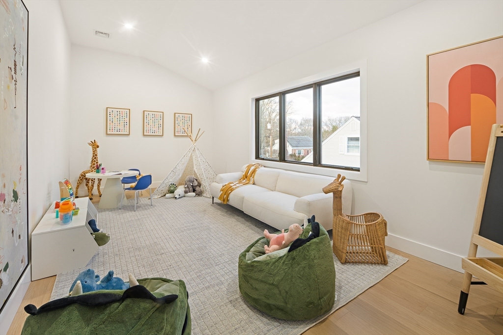 27 2nd Street Natick, MA 01760 - Photo 29 of 39 a living room with furniture fireplace and a window