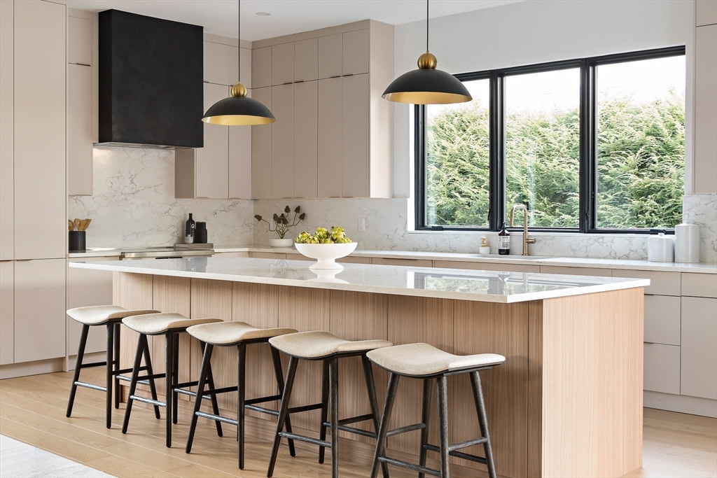 27 2nd Street Natick, MA 01760 - Photo 3 of 39 a kitchen with a table chairs sink and cabinets