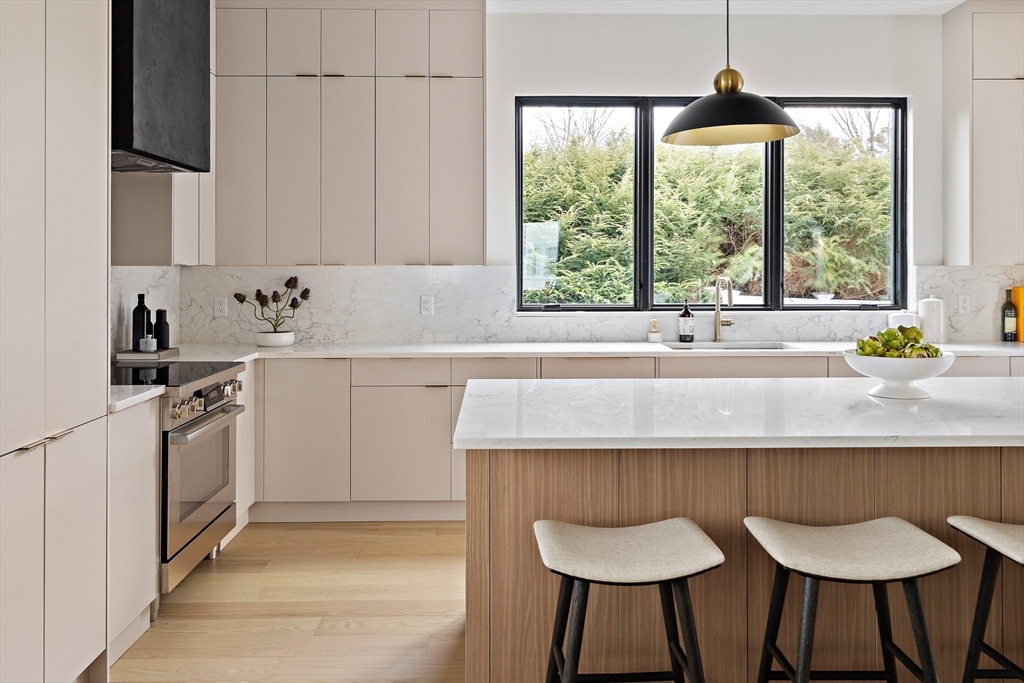 27 2nd Street Natick, MA 01760 - Photo 5 of 39 a kitchen with a sink and a stove