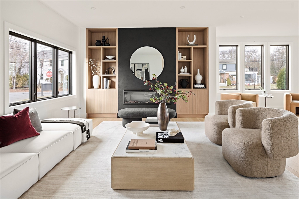 27 2nd Street Natick, MA 01760 - Photo 6 of 39 a living room with furniture a large window and flat screen tv
