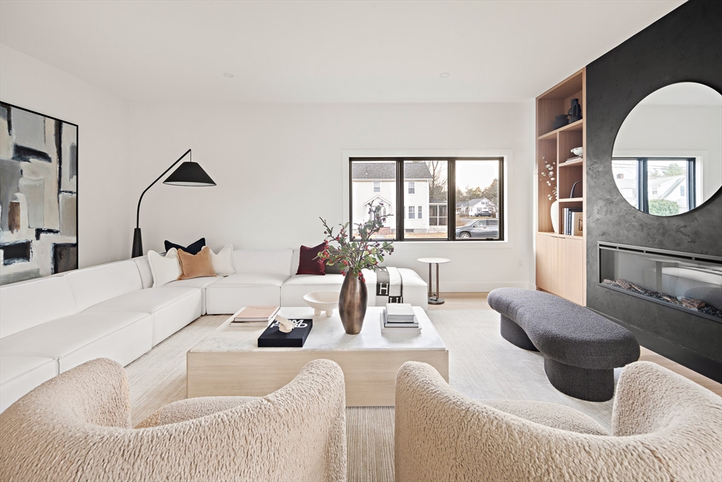 27 2nd Street Natick, MA 01760 - Photo 7 of 39 a living room with furniture and a window