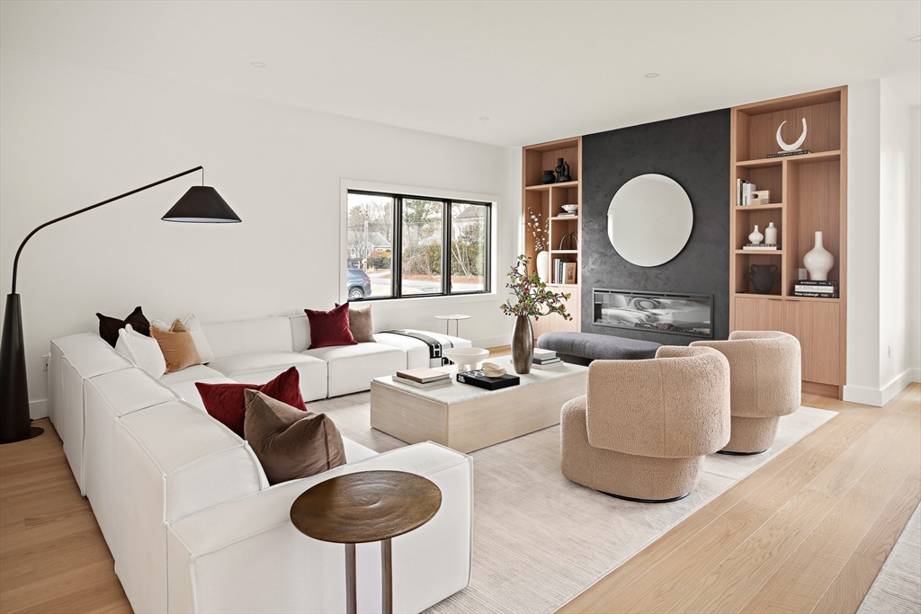 27 2nd Street Natick, MA 01760 - Photo 8 of 39 a living room with furniture and a lamp